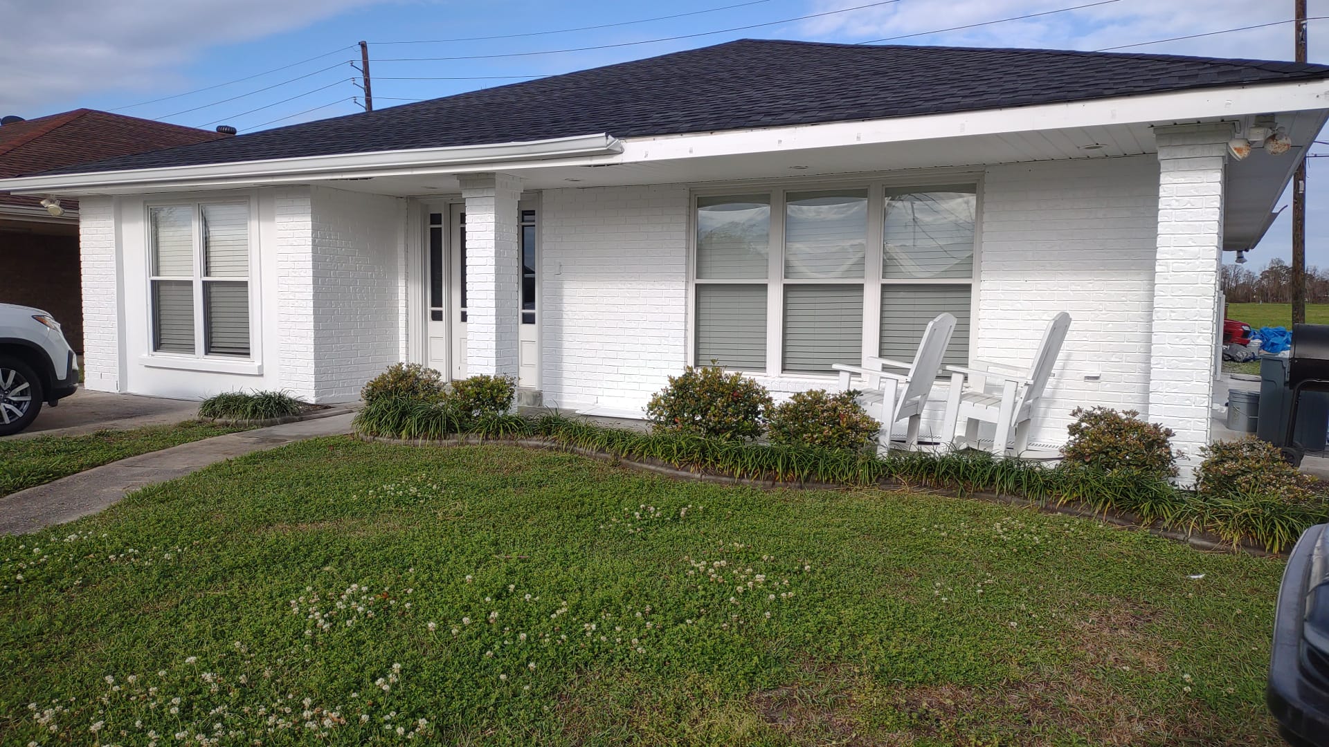 A single story house with freshly painted white walls and trim