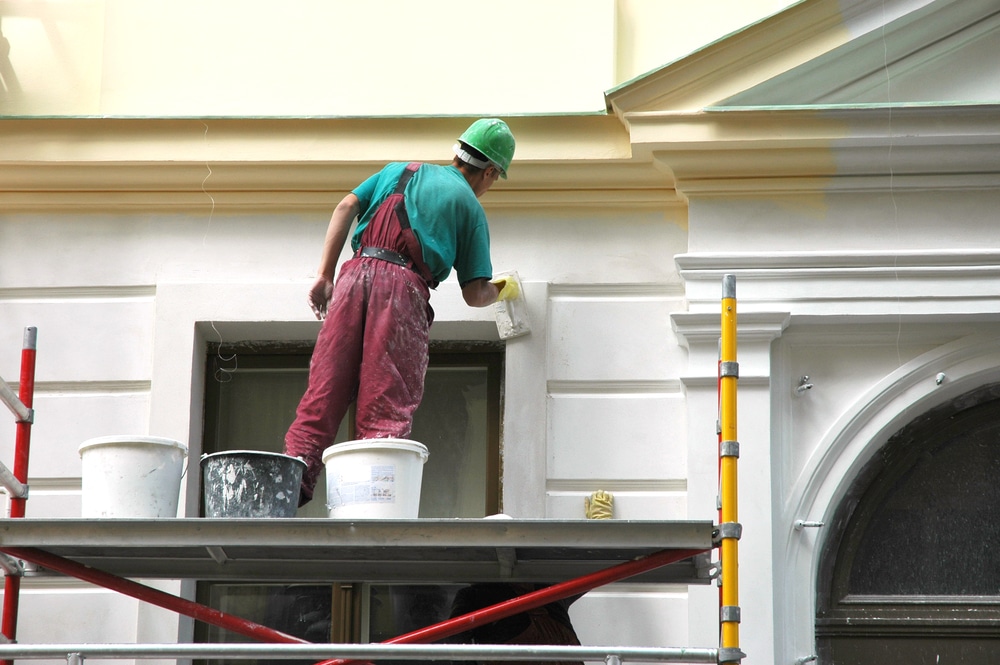 A painted house exterior with white trim