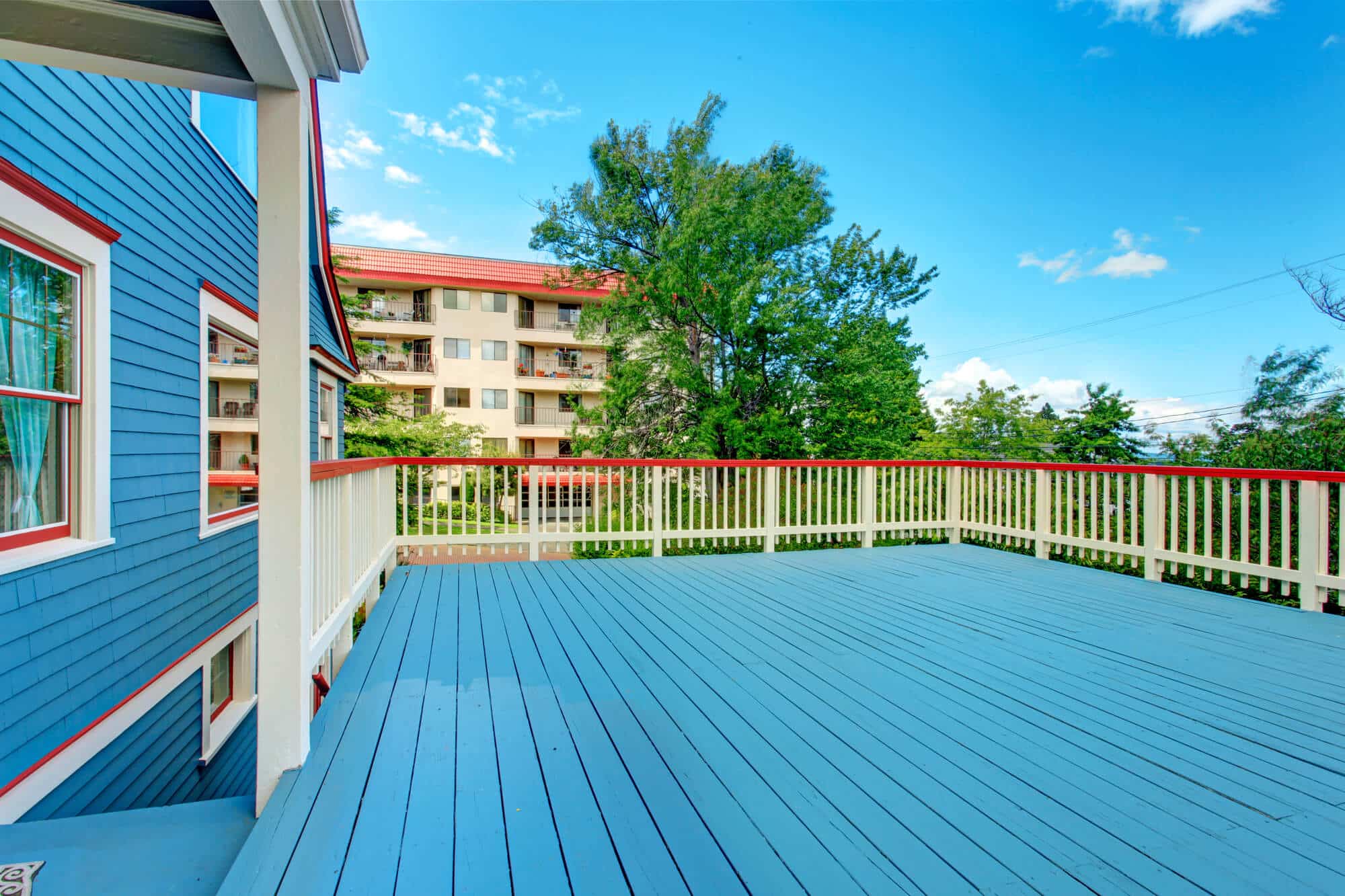 A wood deck finished in a blue-gray coating