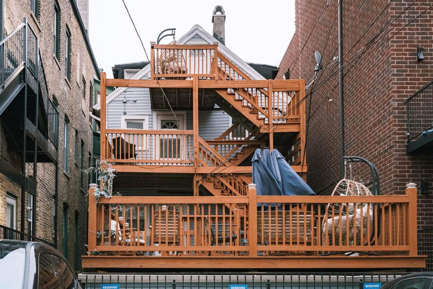 A multi-level timber deck and stair on the back of a building