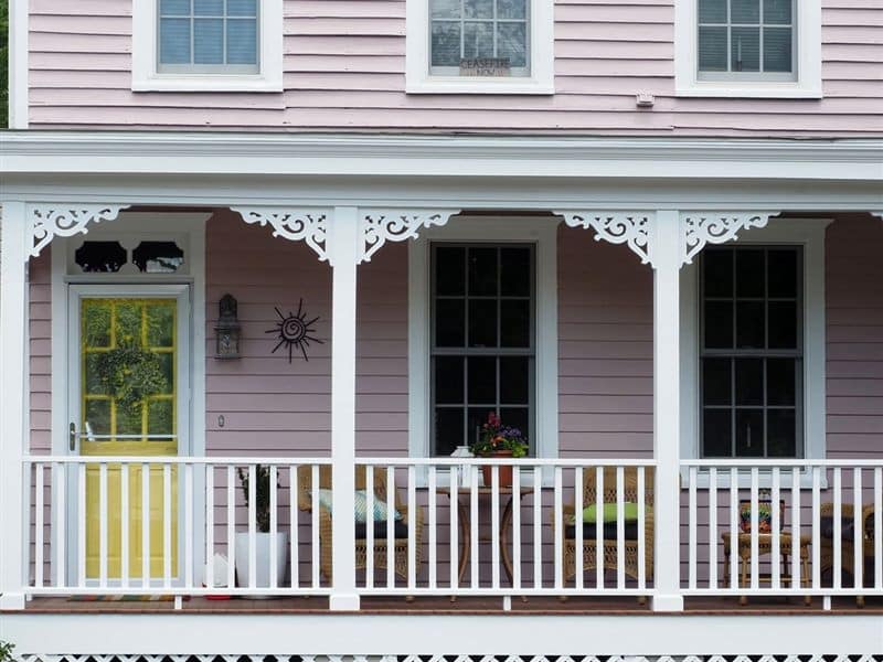 A washed and repainted porch with white trim on a historic house
